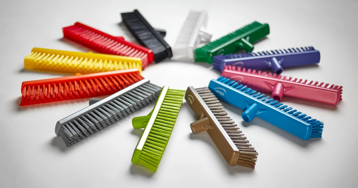 12 Vikan broom heads in a variety of colors